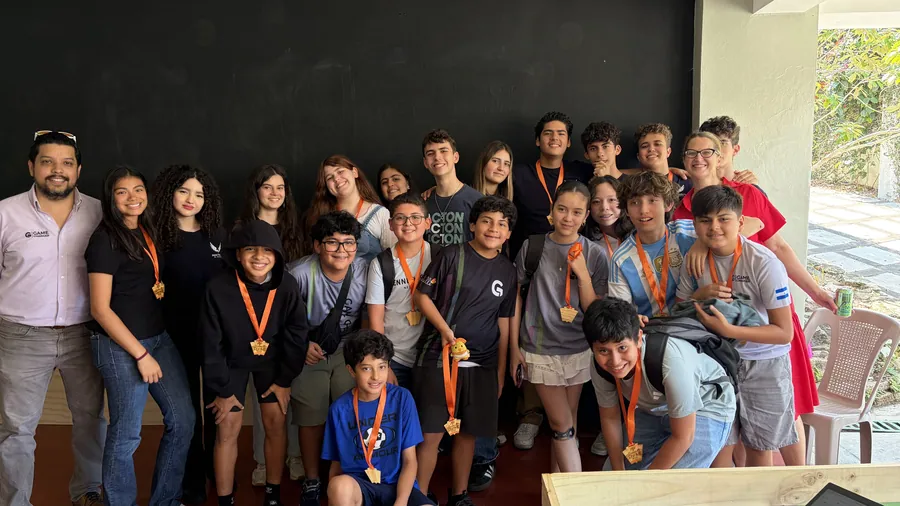 Acton Academy El Salvador learners celebrating together with their medals